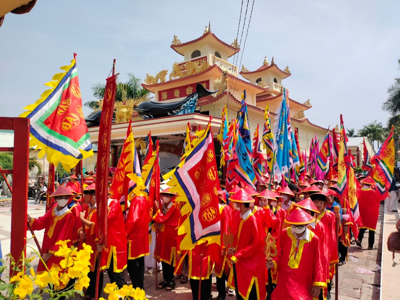 A parade of people during the Nghinh Ông Festival